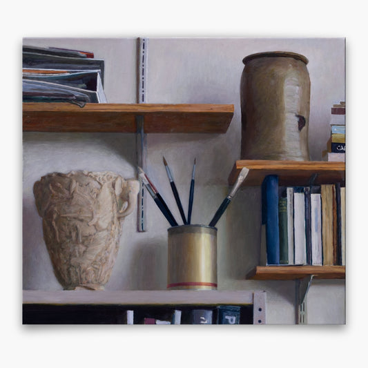 "Shelves in studio with books, brushes and other objects"