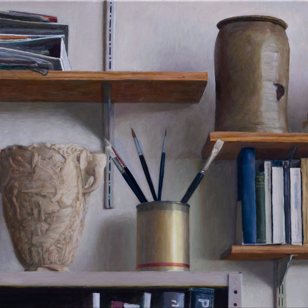 "Shelves in studio with books, brushes and other objects"