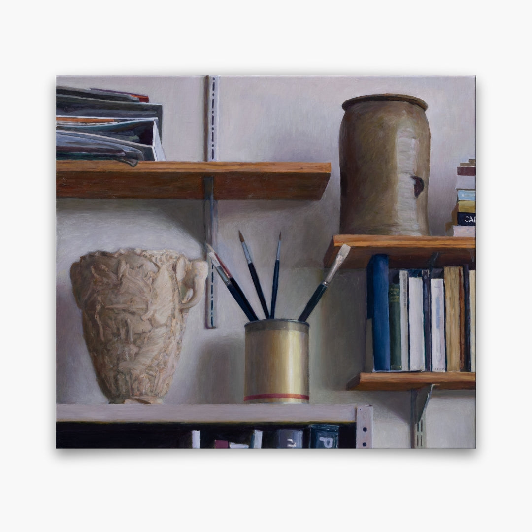 Shelves in studio with books, brushes and other objects
