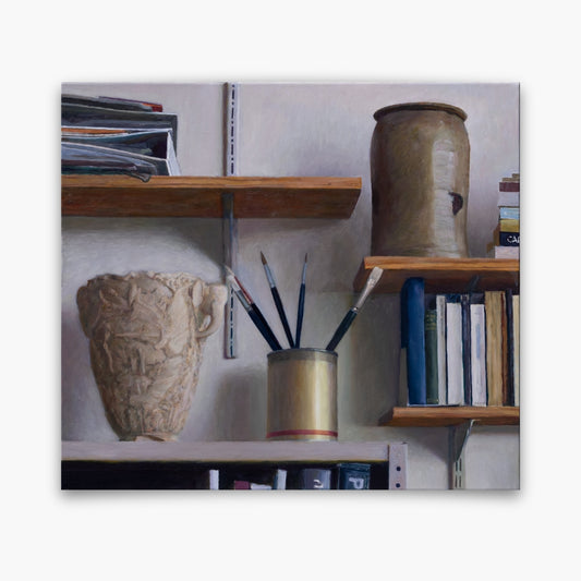 Shelves in studio with books, brushes and other objects